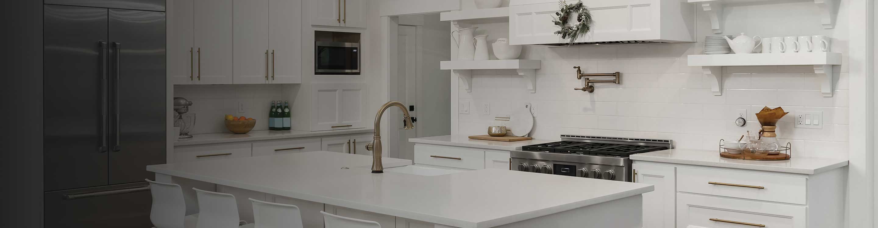 kitchen tile flooring in kitchen with white stone countertops and cabinets