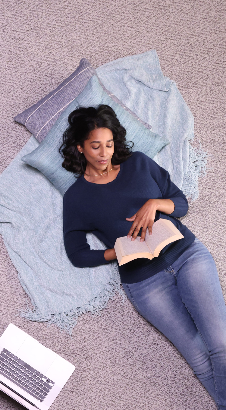 women laying on cozy carpet