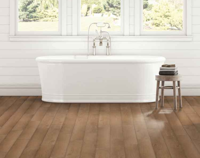 wood look luxury vinyl flooring in bathroom with soaker tub